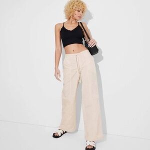 Women's Mid-Rise Wide Leg Parachute Pants - Wild Fable light beige.